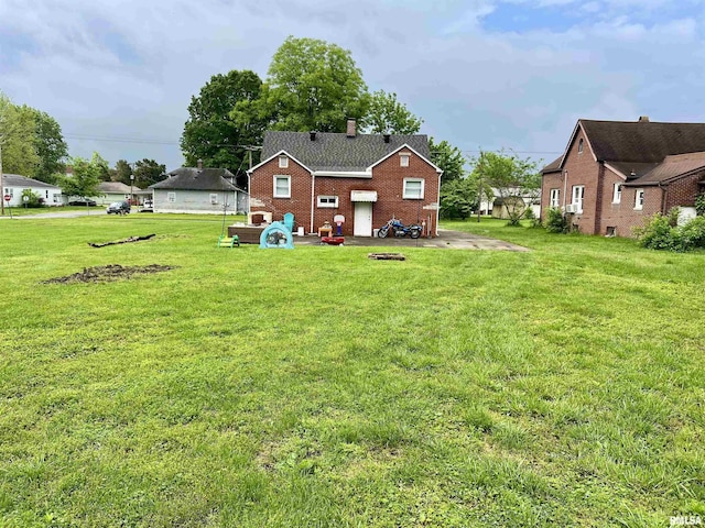 405 E Saint Louis St, West Frankfort, IL 62896 - view of green lawn featuring a patio area