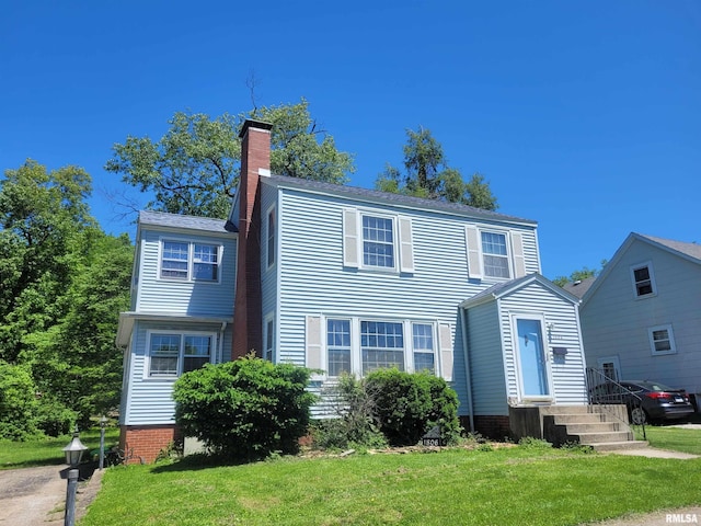 1806 Pace Ave, Mount Vernon, IL 62864 - view of front of house with a front yard and a chimney