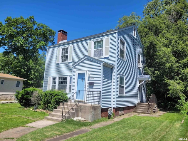 1806 Pace Ave, Mount Vernon, IL 62864 - view of front of property featuring a chimney and a front yard