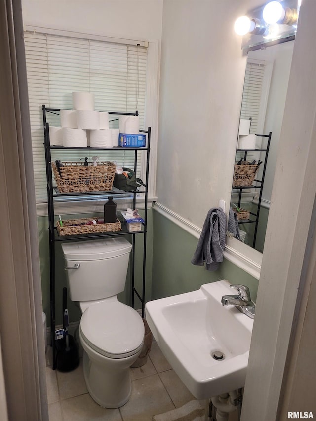 1806 Pace Ave, Mount Vernon, IL 62864 - half bathroom featuring toilet, tile patterned floors, and a sink