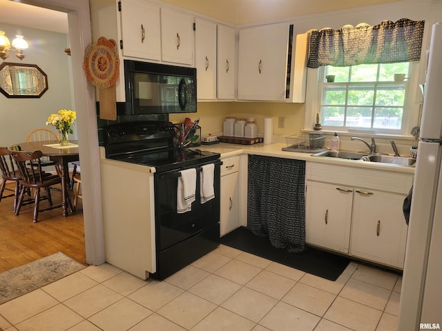1806 Pace Ave, Mount Vernon, IL 62864 - kitchen featuring black appliances, a sink, white cabinetry, light countertops, and light tile patterned flooring