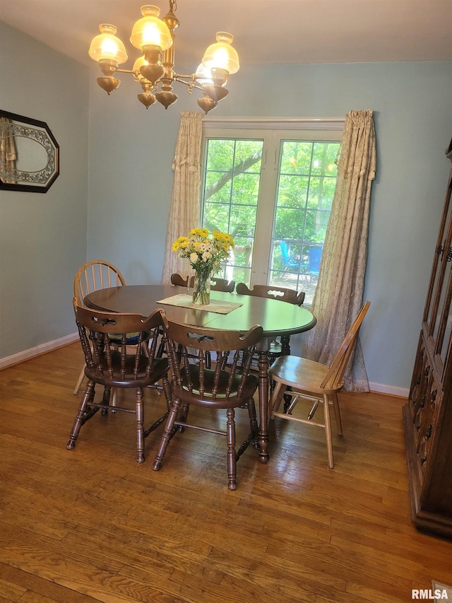 1806 Pace Ave, Mount Vernon, IL 62864 - dining area with a chandelier, wood finished floors, and baseboards