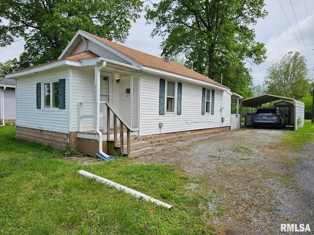 2307 Perkins Ave Unit A, Mount Vernon, IL 62864 - view of front of house with a carport, driveway, and a front lawn