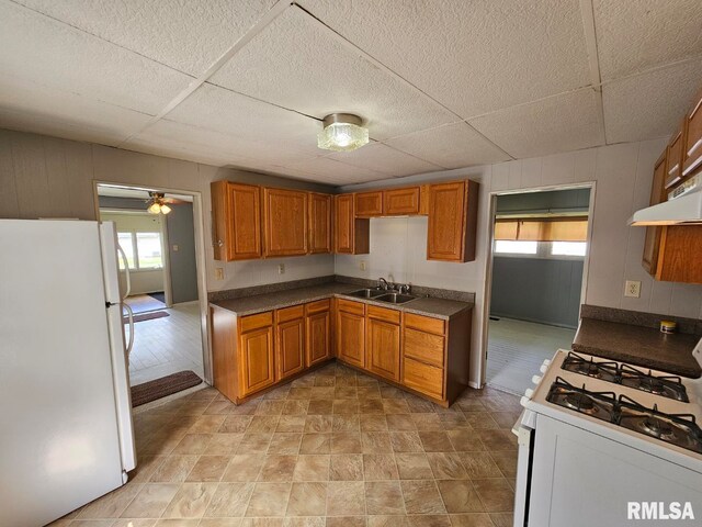 2307 Perkins Ave Unit A, Mount Vernon, IL 62864 - kitchen with white appliances, a sink, brown cabinets, healthy amount of natural light, and a paneled ceiling