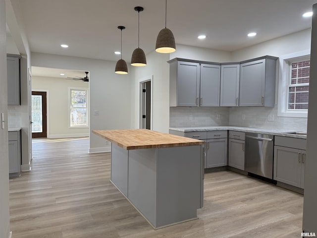 920 E 3rd St, Centralia, IL 62801 - kitchen with stainless steel dishwasher, gray cabinets, butcher block countertops, tasteful backsplash, and recessed lighting