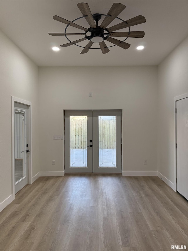 920 E 3rd St, Centralia, IL 62801 - unfurnished room with french doors, light wood-style flooring, ceiling fan, baseboards, and recessed lighting
