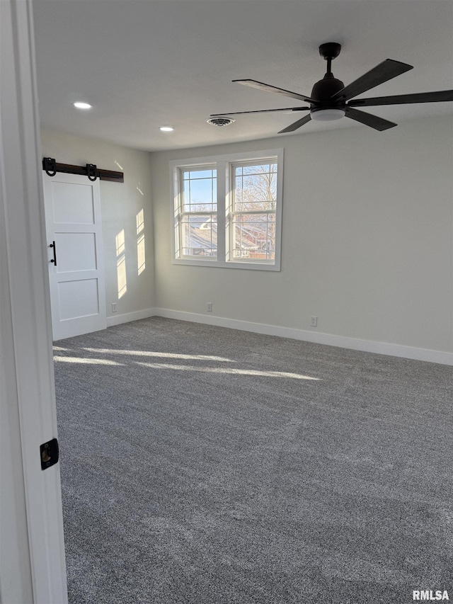 920 E 3rd St, Centralia, IL 62801 - carpeted empty room featuring a ceiling fan, a barn door, baseboards, and recessed lighting