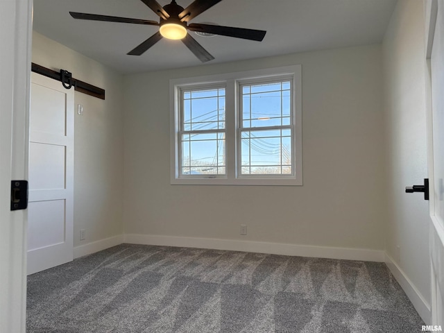 920 E 3rd St, Centralia, IL 62801 - unfurnished room with dark colored carpet, healthy amount of natural light, baseboards, and a ceiling fan