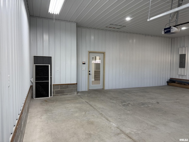 920 E 3rd St, Centralia, IL 62801 - garage with electric panel and a garage door opener
