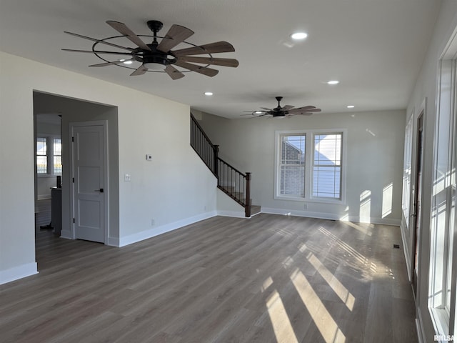 920 E 3rd St, Centralia, IL 62801 - unfurnished living room featuring a ceiling fan, recessed lighting, baseboards, wood finished floors, and stairway
