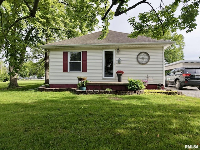 105 E Yung St, Sesser, IL 62884 - view of front of house with a front lawn and a shingled roof