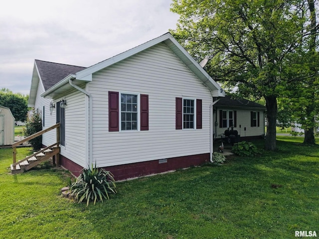 105 E Yung St, Sesser, IL 62884 - view of side of home featuring a yard, crawl space, a shed, an outdoor structure, and entry steps