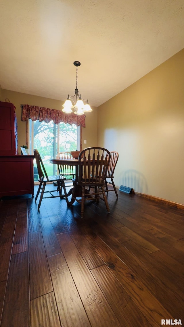 105 E Yung St, Sesser, IL 62884 - dining room with dark wood-type flooring and a chandelier