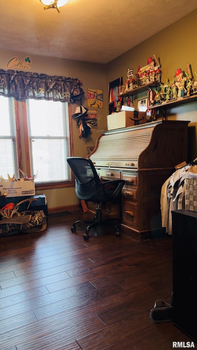 105 E Yung St, Sesser, IL 62884 - bedroom with wood-type flooring and a textured ceiling