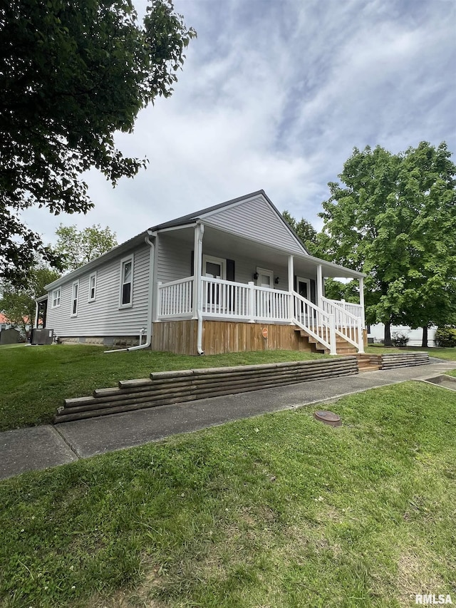 2704 Cherry St, Mount Vernon, IL 62864 - view of front facade with a front lawn and covered porch