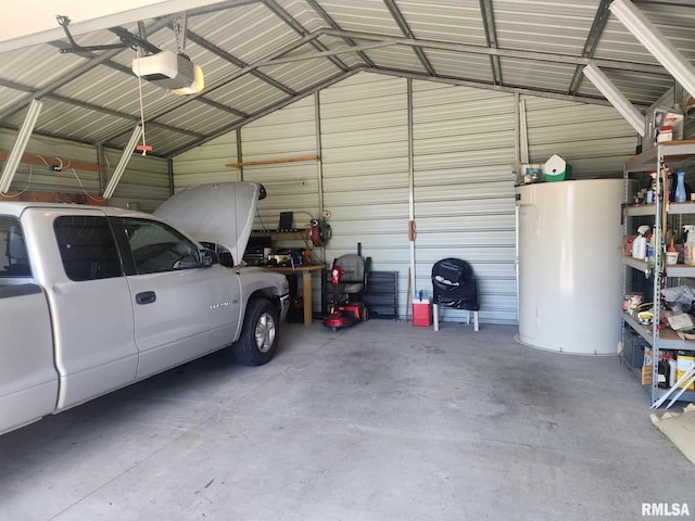 312 Beulah St, Christopher, IL 62822 - garage featuring a garage door opener, gas water heater, and metal wall