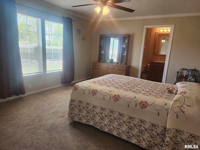 312 Beulah St, Christopher, IL 62822 - carpeted bedroom with ornamental molding, baseboards, ceiling fan, and ensuite bathroom