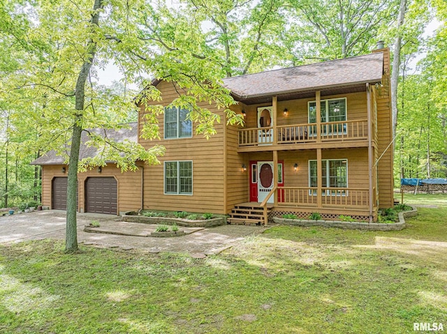 15751 E Tolle Rd, Mount Vernon, IL 62864 - rustic home with a balcony, covered porch, a garage, concrete driveway, and a shingled roof