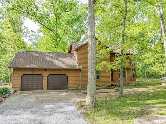 15751 E Tolle Rd, Mount Vernon, IL 62864 - view of front of house with gravel driveway, an attached garage, and roof with shingles