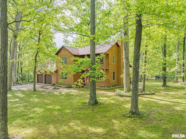 15751 E Tolle Rd, Mount Vernon, IL 62864 - chalet / cabin featuring a chimney, a front yard, a wooden deck, driveway, and a shingled roof