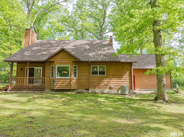 15751 E Tolle Rd, Mount Vernon, IL 62864 - rear view of property featuring a chimney, a yard, a porch, and a shingled roof
