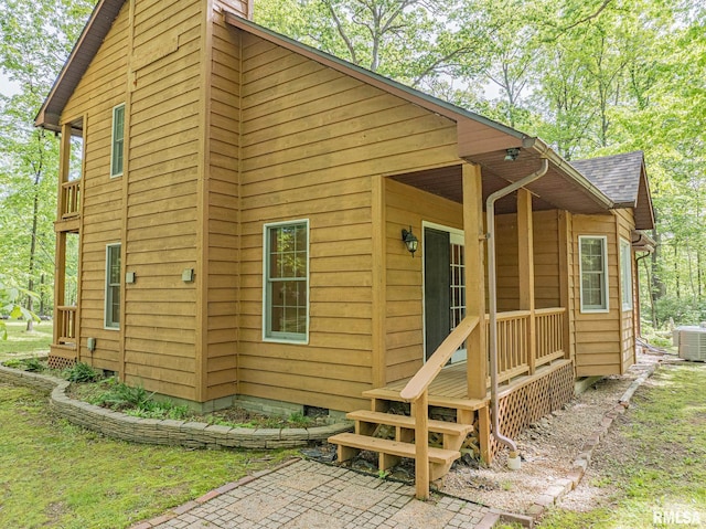 15751 E Tolle Rd, Mount Vernon, IL 62864 - back of house with central AC and a shingled roof