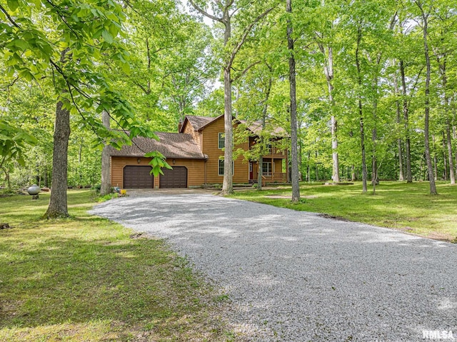 15751 E Tolle Rd, Mount Vernon, IL 62864 - chalet / cabin featuring a garage, driveway, and a front lawn