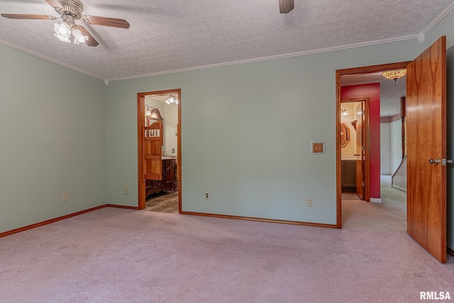 15751 E Tolle Rd, Mount Vernon, IL 62864 - empty room with ceiling fan, a textured ceiling, carpet, crown molding, and baseboards