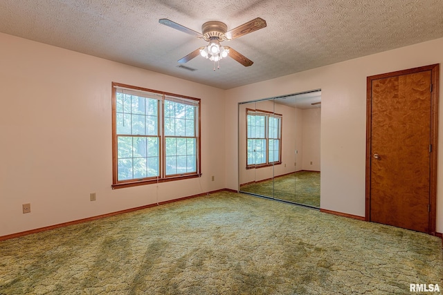 15751 E Tolle Rd, Mount Vernon, IL 62864 - carpeted empty room featuring a ceiling fan, a textured ceiling, and baseboards