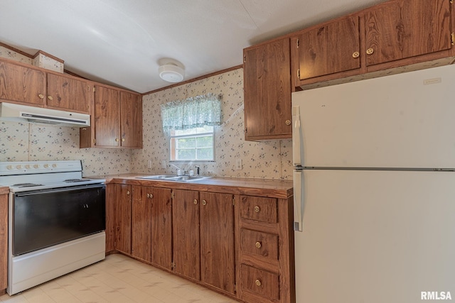 15751 E Tolle Rd, Mount Vernon, IL 62864 - kitchen with white appliances, under cabinet range hood, a sink, wallpapered walls, and brown cabinetry