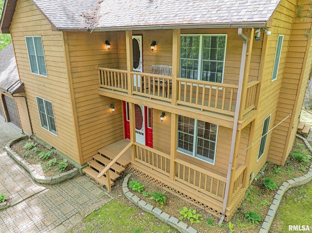 15751 E Tolle Rd, Mount Vernon, IL 62864 - view of front of home with a balcony, a shingled roof, and a garage