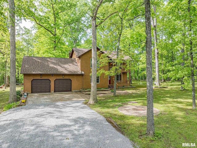 15751 E Tolle Rd, Mount Vernon, IL 62864 - view of side of home featuring a garage, driveway, a yard, and a shingled roof