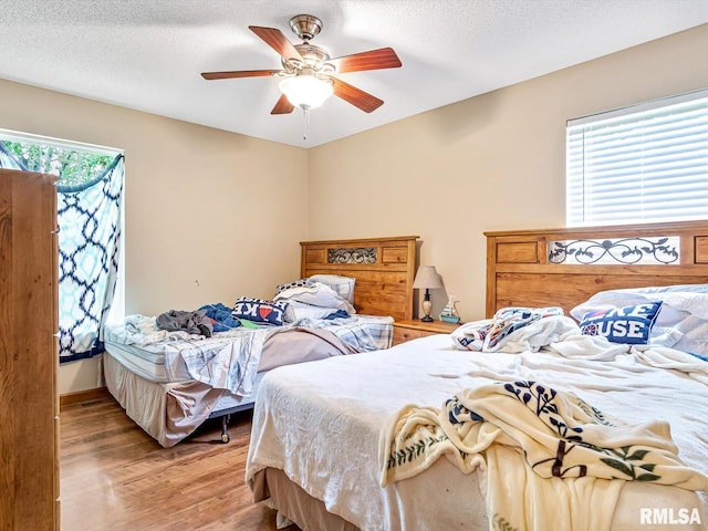 2234 Cascade Ln, Centralia, IL 62801 - bedroom featuring wood finished floors, a ceiling fan, and a textured ceiling