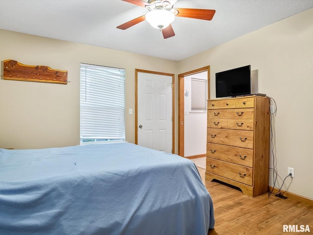 2234 Cascade Ln, Centralia, IL 62801 - bedroom with light wood-style flooring, baseboards, and ceiling fan