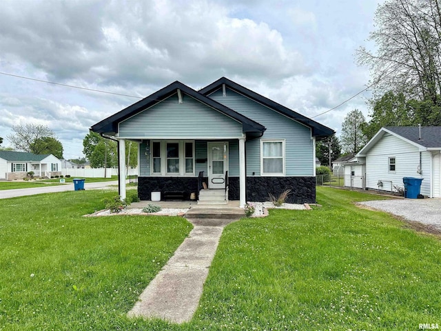 401 S 1st St, Marion, IL 62959 - view of front of property featuring covered porch, a front lawn, and stone siding