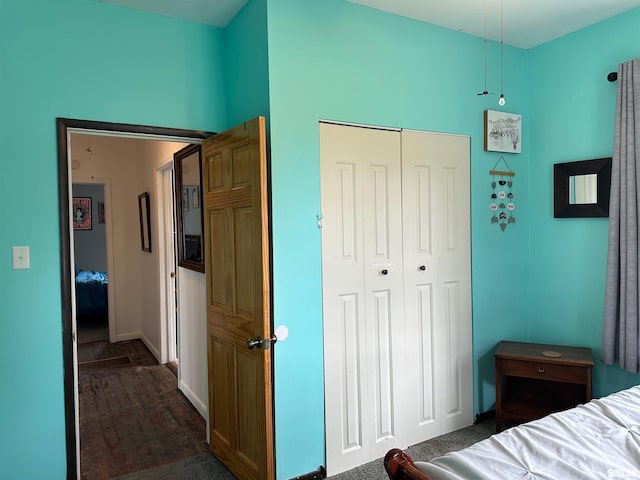 401 S 1st St, Marion, IL 62959 - bedroom with dark carpet, a closet, and baseboards
