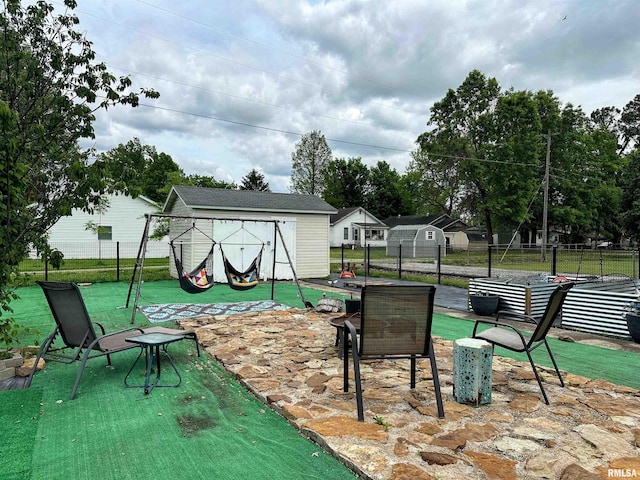 401 S 1st St, Marion, IL 62959 - view of patio / terrace with a storage unit, fence, and an outdoor structure