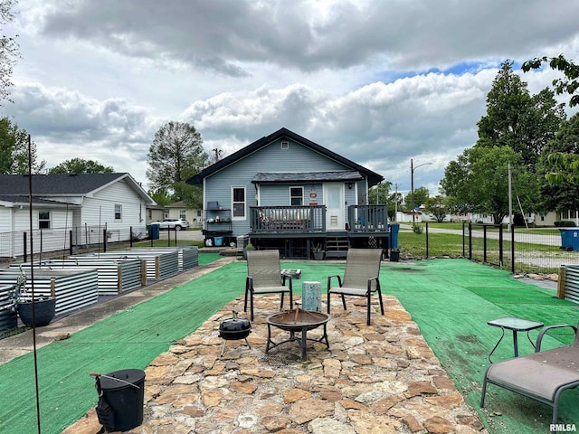 401 S 1st St, Marion, IL 62959 - back of house with a fire pit, a deck, and a patio area
