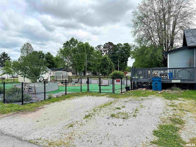 401 S 1st St, Marion, IL 62959 - view of property's community with a gate, fence, and a wooden deck