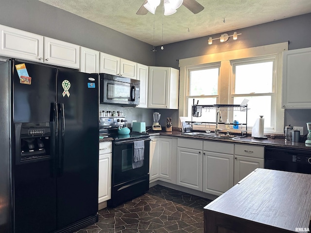 401 S 1st St, Marion, IL 62959 - kitchen with black appliances, a sink, dark countertops, a ceiling fan, and white cabinets