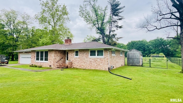 112 Prairie Rd, Carterville, IL 62918 - view of front facade with a garage, brick siding, a chimney, driveway, and a gate