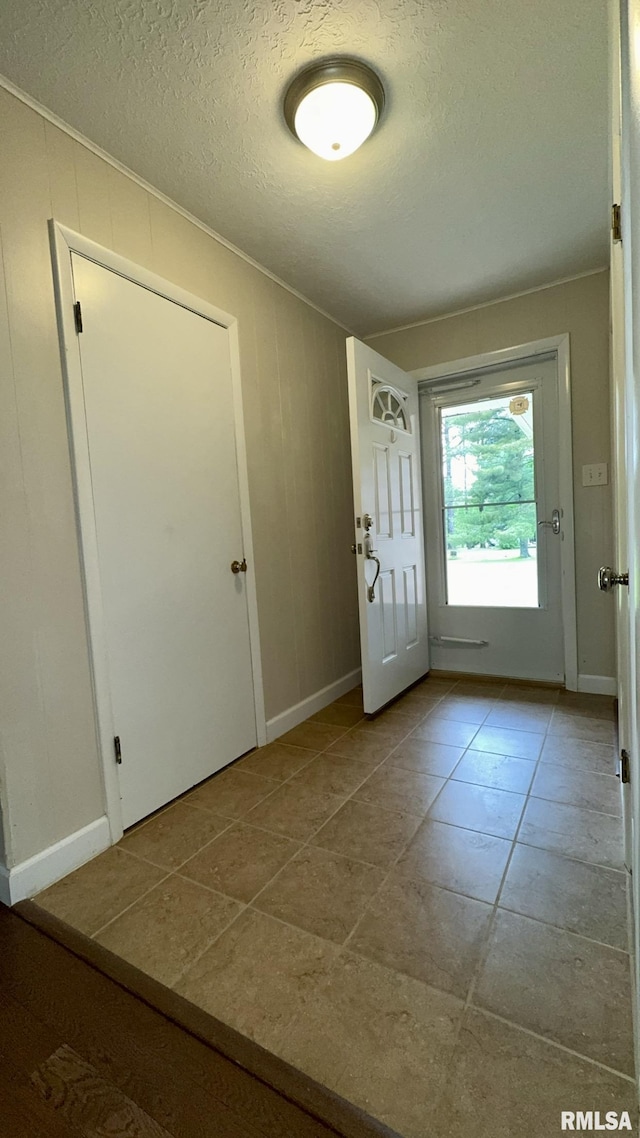 112 Prairie Rd, Carterville, IL 62918 - doorway featuring a textured ceiling and baseboards