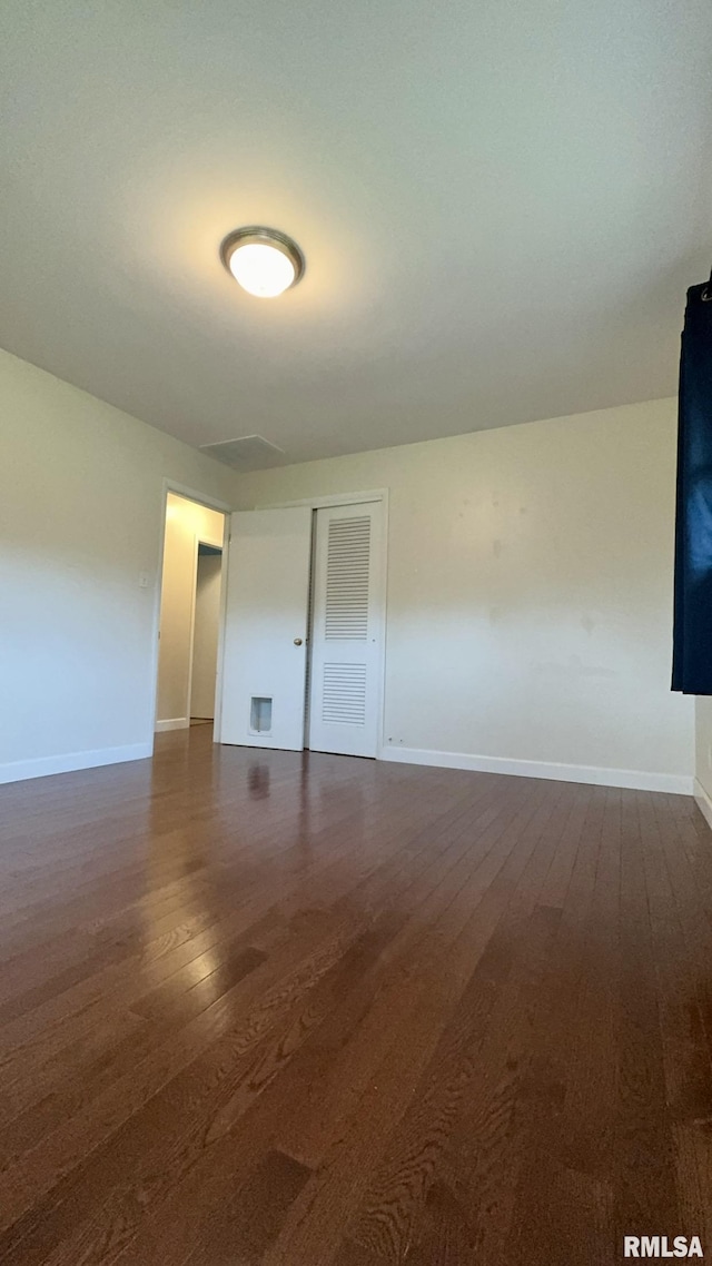 112 Prairie Rd, Carterville, IL 62918 - spare room with dark wood-style floors and baseboards