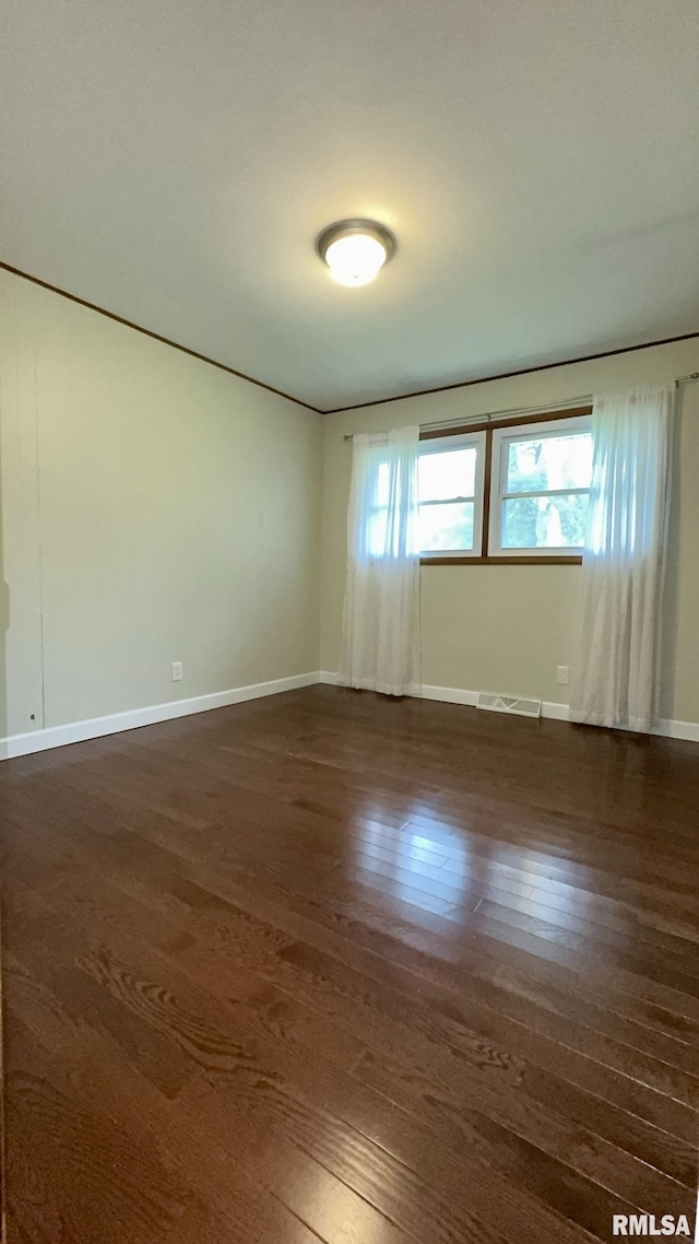 112 Prairie Rd, Carterville, IL 62918 - empty room with dark wood-type flooring and baseboards