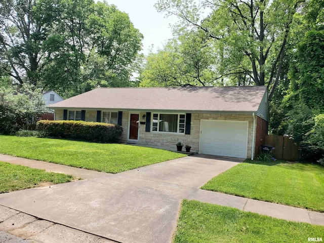 606 S Skyline Dr, Carbondale, IL 62901 - ranch-style house featuring an attached garage, stone siding, and driveway