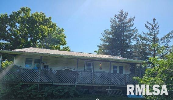 470 Peters Creek Rd, Cave In Rock, IL 62919 - view of front facade featuring a porch and metal roof