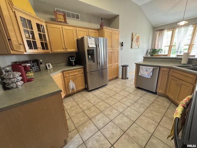 3621 Andrews Ct, Salem, IL 62881 - kitchen featuring appliances with stainless steel finishes, lofted ceiling, a sink, glass insert cabinets, and light tile patterned flooring