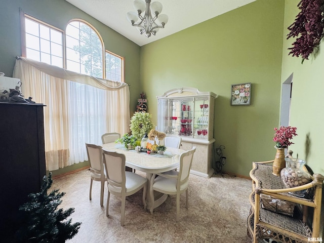 3621 Andrews Ct, Salem, IL 62881 - dining room with a chandelier, high vaulted ceiling, and light colored carpet