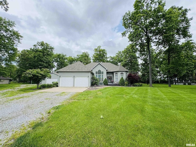 3621 Andrews Ct, Salem, IL 62881 - view of front of house with gravel driveway, a garage, a front lawn, and a shingled roof