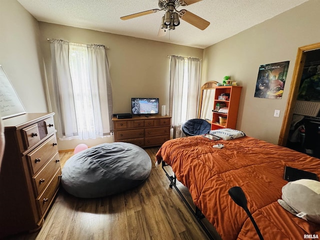 3621 Andrews Ct, Salem, IL 62881 - bedroom with wood finished floors, a textured ceiling, and ceiling fan